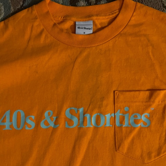 40s & Shorties
Bright orange t-shirt
Size: Medium - Picture 2 of 2